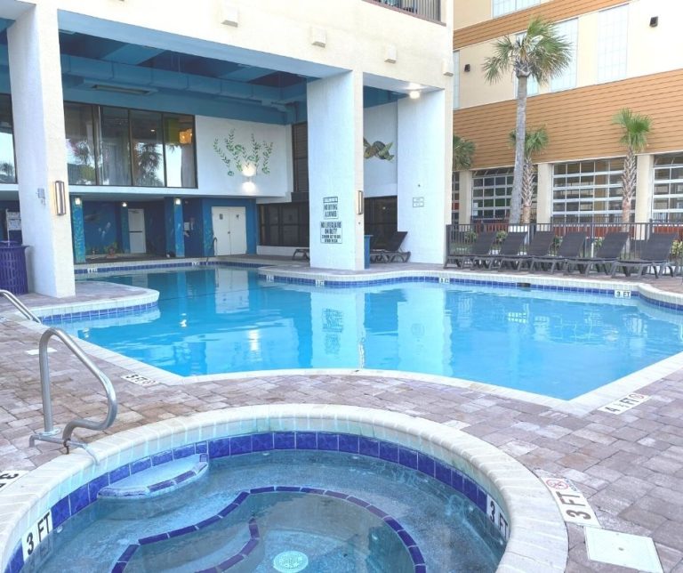 Outdoor pool and hot tub at resort