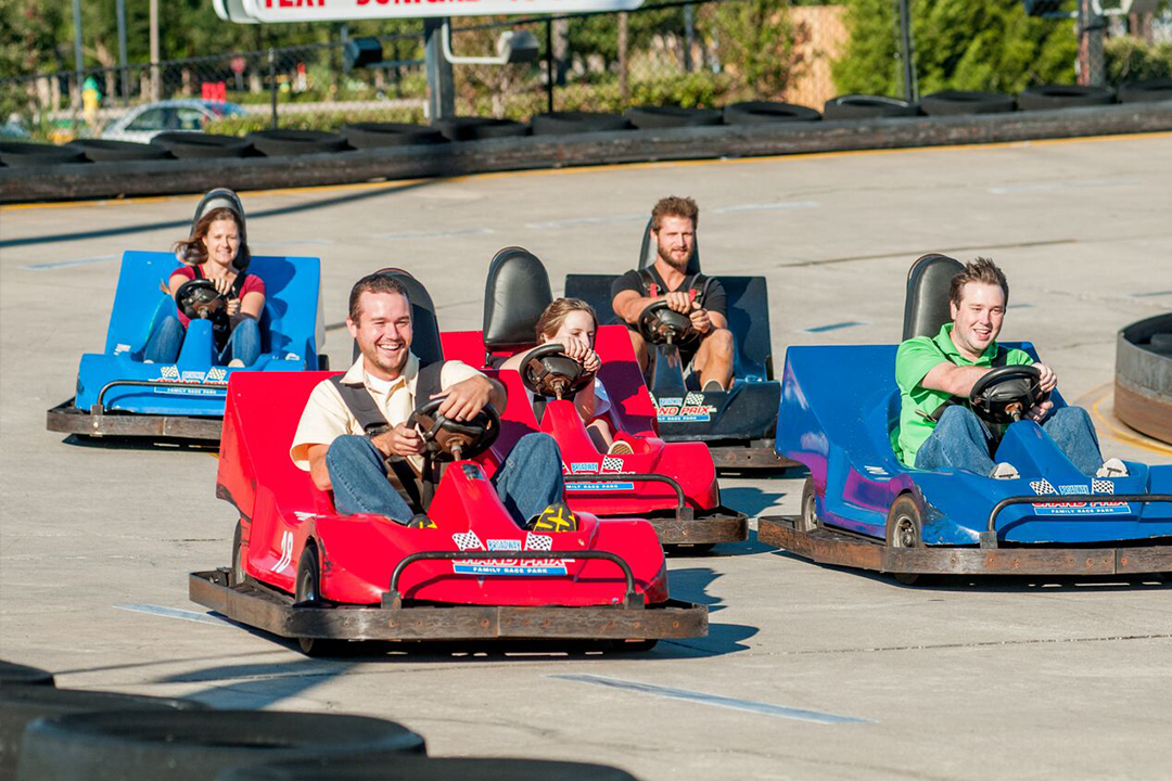 Group of people racing go karts at Broadway Grand Prix in Myrtle Beach