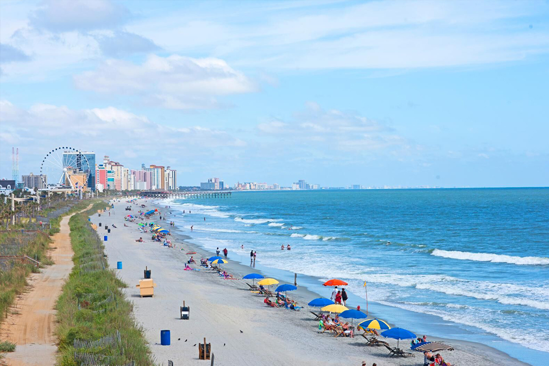 Aerial View of the beach with people enjoying the weather