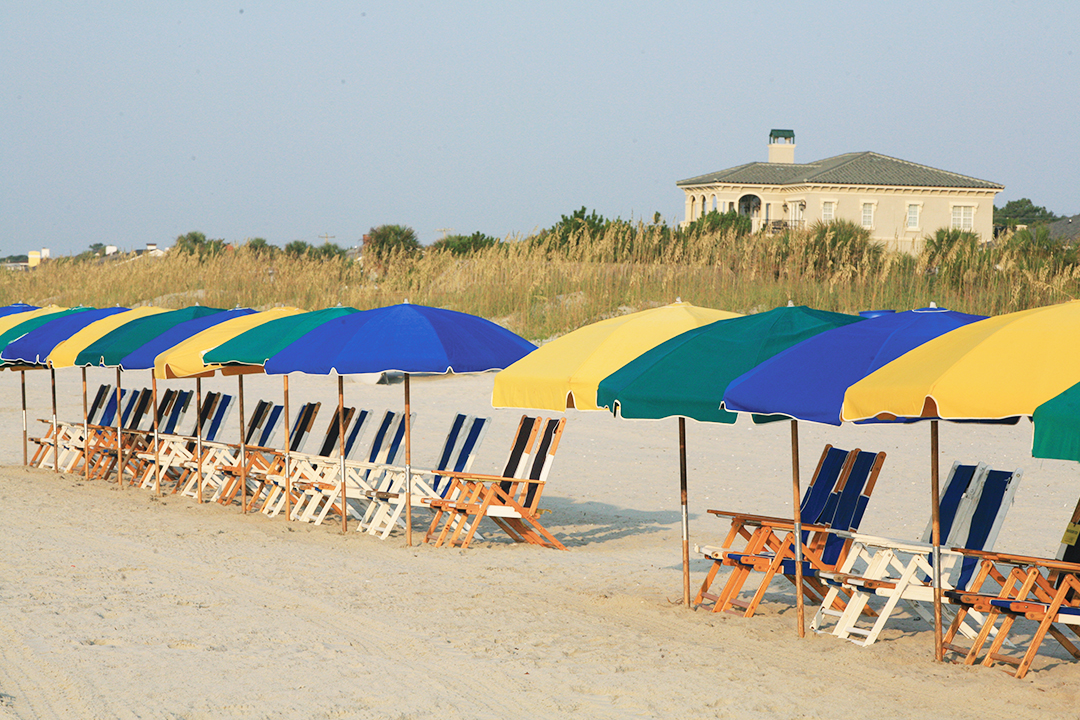 Line of umbrellas and beach chairs on the beach