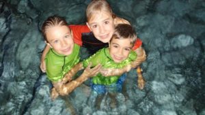 kids smiling in pool