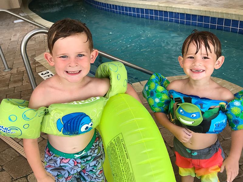 boys with floaties on