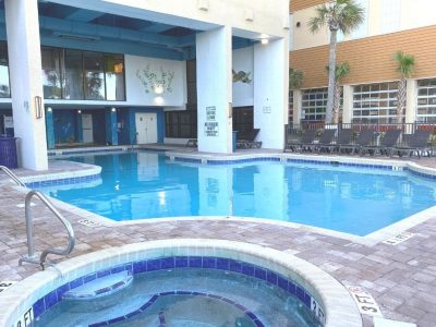 Outdoor pool and hot tub at resort