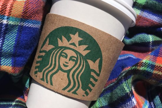 Starbucks cup with flannel background