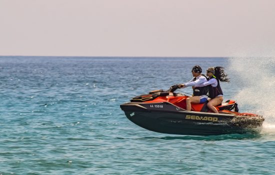 couple jetskiing on the ocean