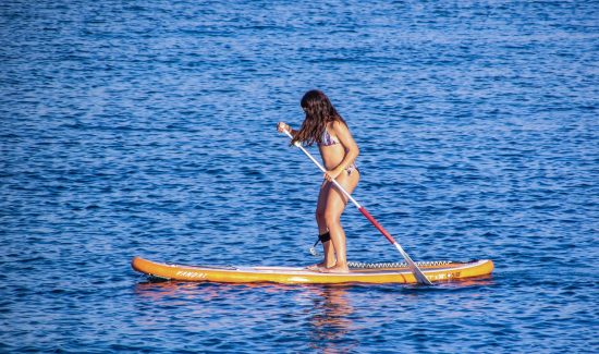 girl paddle boarding